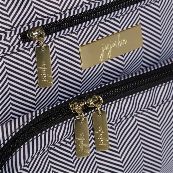 Like new jujube diaper bag. Inside and out clean with no stains. - Picture 4 of 5